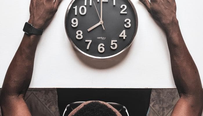 person looking at clock